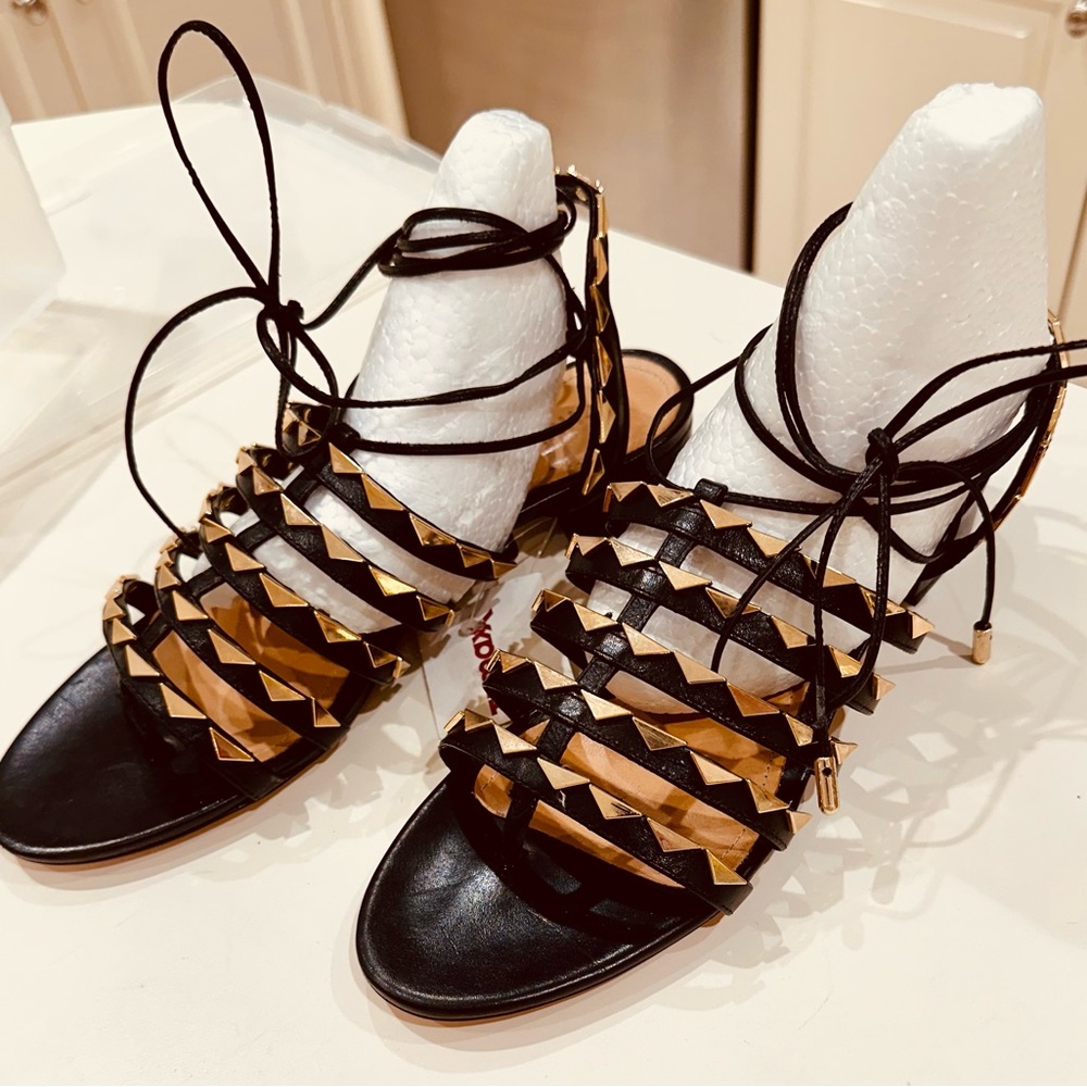 Shultz black leather/gold tone metal embellishments low heel gladiator sandals